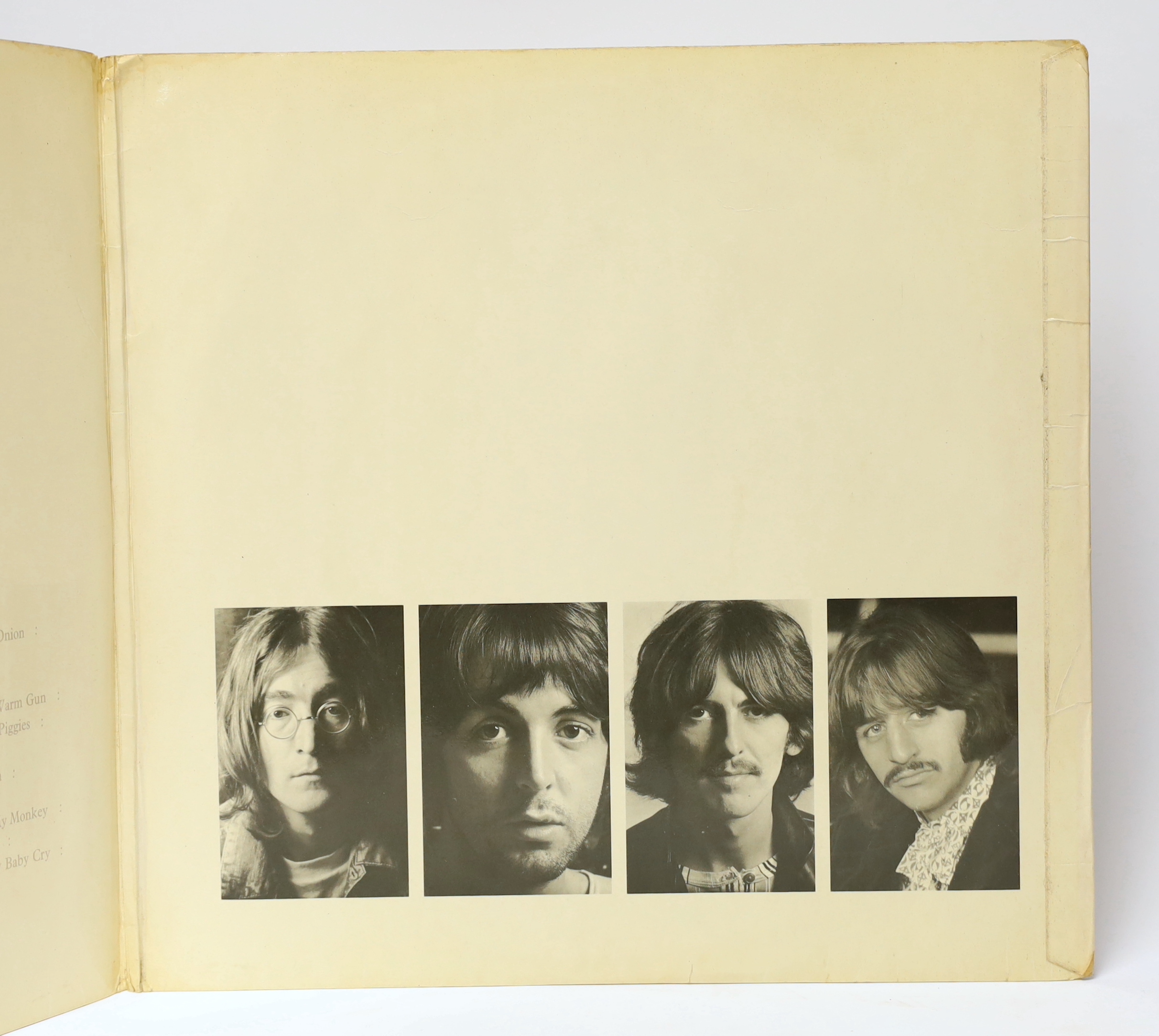 The Beatles; The White Album, top opening cover numbered 0557785, two LPs with set of four photographs and booklet, missing inner sleeves